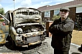 OWNER Michael Lowe, of Surrey Avenue, with his burned-out van