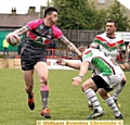 LOOKING FOR SUPPORT: Oliver Roberts prepares to fire out a pass for Oldham at Cougar Park