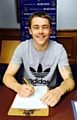 SIGN HERE . . . Athletic new George Green.