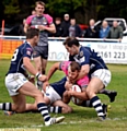 powering through . . . Josh Crowley forces his way over to increase Oldham’s lead against Swinton Lions. PICTURE by TIM BRADLEY