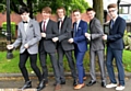 SUITED and booted: from left, Ryan Dunne, Josh Duncan, Marc Egerton, Joe Crozier, Connor White and Ole Chambers