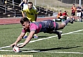 ACROBATICS: Lewis Palfrey touches down for his second try.