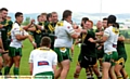 FLASHPOINT . . . Mick Fogerty (centre) tries to act as peacemaker as Oldham St Anne’s and Askam players square-up at Higginshaw Road.