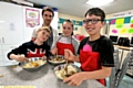 GETTING stuck in (from left): Ethan Branigan (St Anne’s, Royton), Alan Eden, school pupil progress learning practitioner at Royton and Crompton, Molly Sweeney (Beal Vale, Shaw), and Regan Shaw, East Crompton St James’, Shaw). 