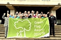 CONGRATULATIONS . . . (front, centre left) Glenn Dale, head of parks and gardens, the Mayor of Oldham, Councillor Ateeque Ur-Rehman, and Mayoress, Councillor Yasmin Toor, celebrate the Green Flag success with council staff