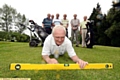 THAT’S THE SPIRIT . . . Oldham captain Steve Mills checks out a fairway, watched by, from the left, fellow club members Keith Cowell, Ray Buckley, Bill Broomhead, John Billington, Mike Dunkerley, Jack Simpson.