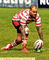 LINED UP: Steve Roper prepares to kick for goal.