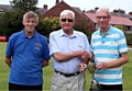 John Atkinson (left) and Price are pictured either side of league president Bill Connolly at the presentation.