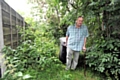 Ian Graham drags his bin through the jungle