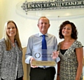 From left: Human resources managerAnna Whittaker, MD Clive Newton and partnerships manager Rukhsana Nabi with the IIP award.