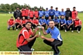 UP FOR GRABS . . . Pro League skipper Qaisar Abbas (left) and ONQ captain Gharib Razak, watched by their team-mates, get their hands on the trophy before the final at Hollinwood.