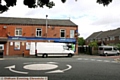 A man was knocked down and left for dead at this roundabout at the junction of Roman Road and Ashton Road East