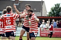 WHAT A RESULT: Lewis Palfrey (second right) leads the celebrations.