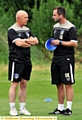 THINK TANK . . . Jim Harvey (left) talks to manager Darren Kelly before his exit.