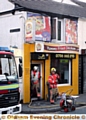 Firefighters clean up after the Shaw fast-food blaze