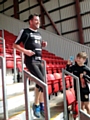 STEPPING it up for charity . . . Liam O’Reilly climbs up and down every step in the ground