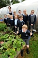 GREEN-fingered: members of the Higher Failsworth Primary gardening club with Claire Yates.
