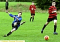 ON THE SLIDE: White House’s Kieran Glynn gets in a shot.