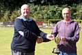 FRANK Cassidy (right) receives the President’s Cup from Veterans’ League vice-chairman Roy Kelly.