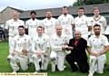 IT’S YOURS: surrounded by his team-mates, Saddleworth captain Brian Lord accepts the Twenty20 trophy from sponsor Mohammed Naveed, of Pro-Elite Sports.