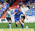 BATTLE FOR THE BALL: Shrews star Ryan Woods (left) tussles with Athletic’s David Dunn in last month’s meeting