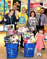 THUMBS-UP: (from left) Alisha-Paige Harrison, store manager Colin Waters, sales assistant Gary Buckley, Carmen-Amy Harrison, manager Gary Rumens and Takoda-Tracey Wright
