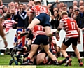 Adam Clay is mobbed by his team mates after scoring his side’s fifth try of the afternoon. 