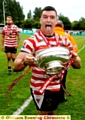 YOU BEAUTY: Liam Thompson celebrates with the silverware.