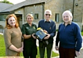 paramedic Lisa Stanley of North West Ambulance Service with guardians Valerie and Martin Smith and former councillor Alan Roughley.