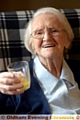 Gladys Wild celebrates with a glass of orange