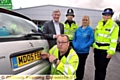 Pictured at the number plate crime prevention day are (back, from the left) Police and Crime Commissioner Tony Lloyd, PC Kristian Kurmul, car owner Tracy Eccles and PCSO Joanna Haigh. Front is AA mechanic Chris Handley