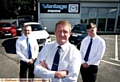 IN the driving seat . . . (from left) David A Cunningham, Vantage Oldham centre principal, with staff Andy McGevor and Simon Barlow