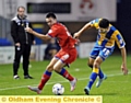 GETTING SHIRTY . . . lone striker Rhys Turner is tugged back by an uncompromising Shrewsbury defender.