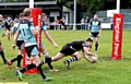 Gareth Morgan dives in for Saddleworth Rangers. PICTURES by TIM BRADLEY
