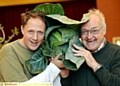 Denshaw flower and home produce show chairman Andrew Vance and committee member Joe Halshall with a fine cabbage specimen