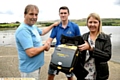 SHAKE my hand . . . Robert Dunn and daughter Emma thank Joe Ready, with the defibrillator
