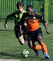 ON THE CHARGE . . . Samuel Opara makes his presence felt for AFC Oldham