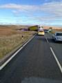 POLICE on the scene as the lorry remains stuck in the mud