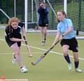 HE Years Seven and Eight hockey competition sees Chloe Major (Oasis Academy, left) challenging Olivia Copple (Newman College)