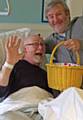 HE's behind you . . . panto dame Fine Time Fontayne hands over the famous sweetie basket to fellow actor Simeon Truby