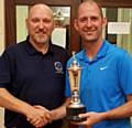 ALL YOURS: Gary Melling receives the Crompton and Royton Club Championship trophy from captain Barry McLoughlin