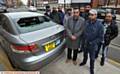 UNDER attack . . . (front, from left) Mohammed Akbar (owner Oldham and Bardsley Cars) with Khizar Islam and fellow drivers