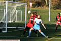 CLOSE . . . Heyside’s Jordan Hindley (blue shirt) puts pressure on Hollinwood
