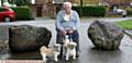 Local resident, Kevin Geany, claims Oldham council has blocked access to the car park at the back of Hollinwood cemetery  due to problems with fly tipping, which means no one can access the car park. Pic shows, Kevin with his two Shihtzu dogs, Jasper, (left) and Jamie, (right).
