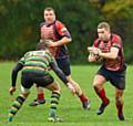 DRIVING FORCE . . . Oldham's Will Mellor attacks the Littleborough defence