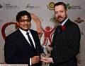 GEEK TREAT . . . Love Where You Live winner Andy Powell, of Hack Oldham with presenter Councillor Abdul Jabbar.
