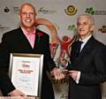 VOLUNTARY Award winner Greg Cookson (left) with presenter Cllr. John Hudson