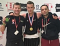 WELL DONE, CHAMP! . . . Andy Stafford is flanked by delighted Chadderton head coach 