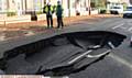 A huge sink hole has appeared in the centre of Rochdale Road, near Tandle Hill Park.