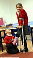 JESSICA Baxter (8) with her brother Callum Baxter (6) signing her cast